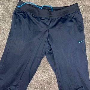 Navy Nike sweatpants with light blue Nike swish